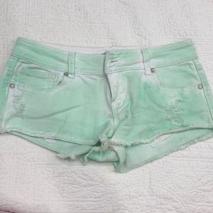 like green and white shorts